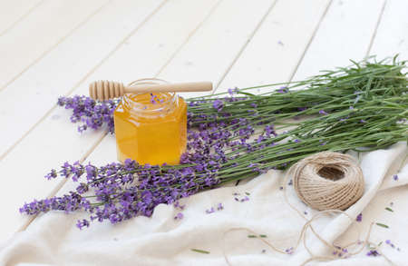 Honey and lavender bouquets. Virus treatment concept. Wooden table.の写真素材
