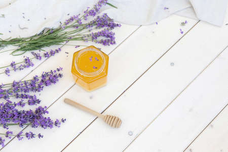 Honey and lavender bouquets. Virus treatment concept. Wooden table.の写真素材
