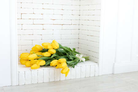 Home interior with a fresh bouquet of tulips.の写真素材