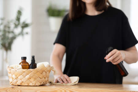 Young woman cleans the kitchen with eco products.の写真素材