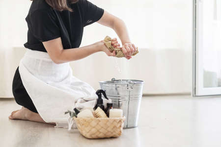 House keeping concept. Woman wiping floor. Woman doing chores at home.の写真素材