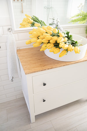 Zero waste concept. A bouquet of peonies in the bathroom.の写真素材