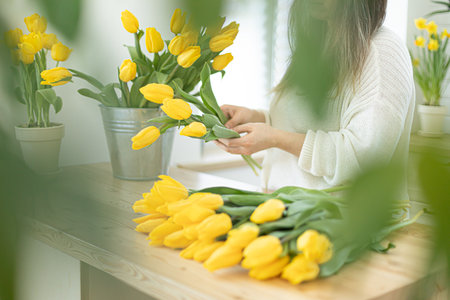 Florist makes a beautiful bouquet tulips.の写真素材
