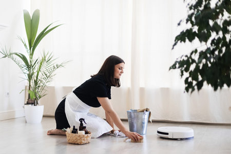 House keeping concept. Woman wiping floor. Woman doing chores at home.の写真素材