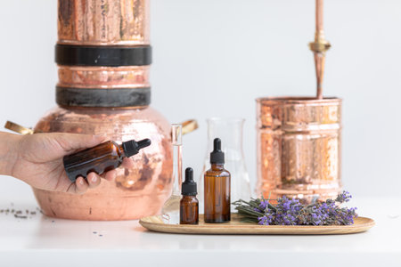 Distillation of lavender essential oil. Copper alambic in a Scandinavian interior. Chemical laboratoryの写真素材