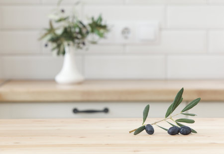 Scandinavian kitchen interior. Product display template. Surface of a wooden table. Business presentation.の写真素材