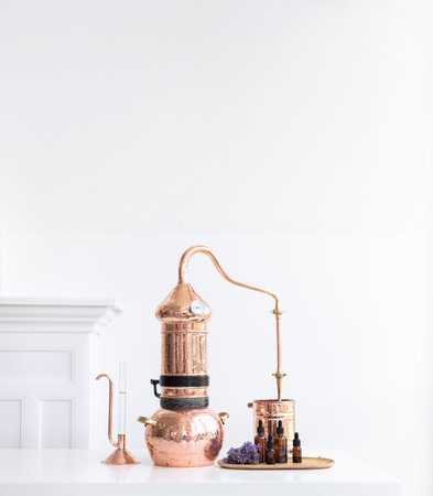 Distillation of lavender essential oil. Copper alambic in a Scandinavian interior. Chemical laboratoryの写真素材