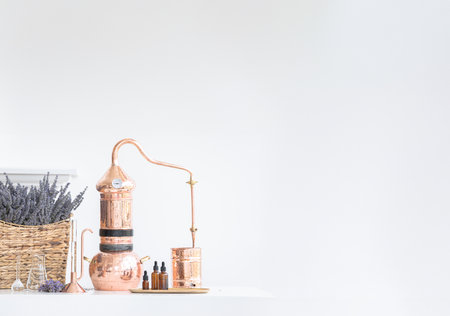 Distillation of lavender essential oil. Copper alambic in a Scandinavian interior. Chemical laboratoryの写真素材