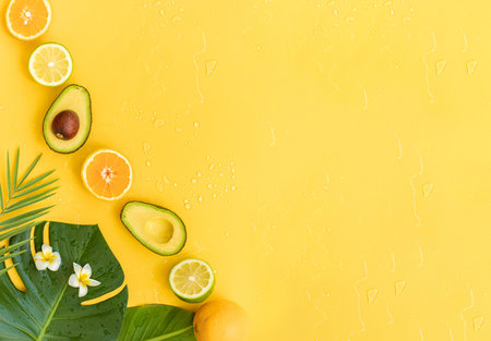 Fresh oranges and tropical leaf. Cutted citrus fruit for natural cosmetics.の写真素材