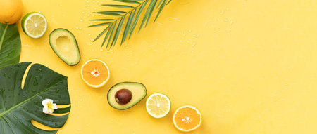 Fresh oranges and tropical leaf. Cut citrus fruit for natural cosmeticsの写真素材