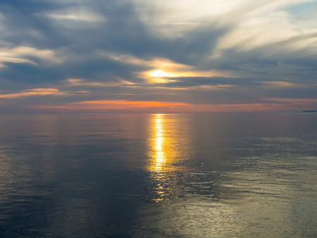 Beautiful sunset in Adriatic sea, Montenegro, captured from a sailing boatの写真素材