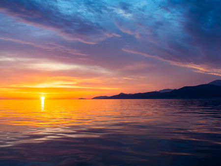 Beautiful sunset in Adriatic sea, Montenegro, captured from a sailing boatの写真素材