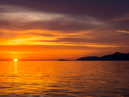 Beautiful sunset in Adriatic sea, Montenegro, captured from a sailing boatの写真素材