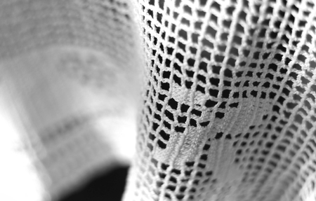 Close-up photo of crocheted tablecloth. Black nad white.の写真素材