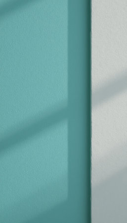 Soft shadows dance on a vibrant turquoise wall, creating a serene interplay of light and color. This minimalist composition captures the essence of tranquility, inviting viewers to appreciate the beauty of simplicity and the calming effect of soft huesの素材
