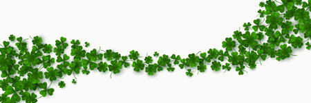 Green flying clover leaves isolated on white background. vector illustration. Spring decoration for Patrick's day border or frame designのイラスト素材