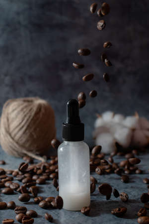 concept organic eco-friendly natural homemade cosmetics. skincare serum and coffee on dark background. slow simple beauty treatment. selective focus.の写真素材