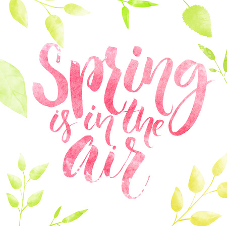 Spring is in the air watercolor lettering in green leaves frame.の写真素材