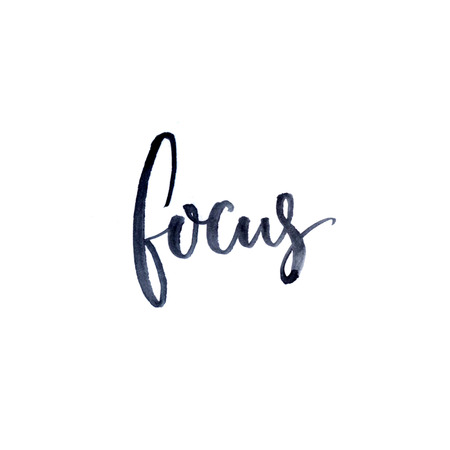 Focus. Minimalistic design about concentration and work. Ink and brush lettering isolated on white backgroundの写真素材
