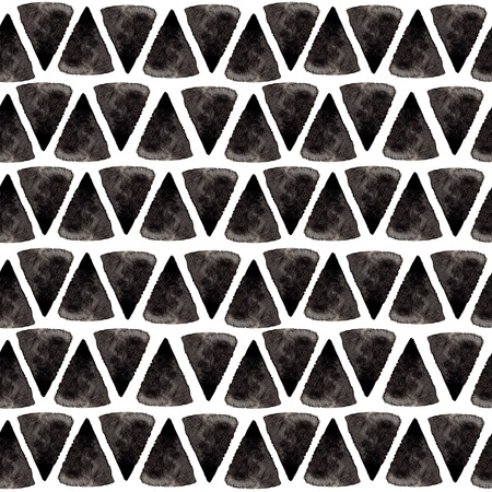 Ink triangle pattern. Relaxed geometry seamless texture with hand painted shapes, blue and black colors. Trendy fashion background, surface design.の写真素材