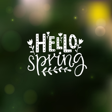 Hello spring inscription on blurred green background. Hand lettering quoteのイラスト素材