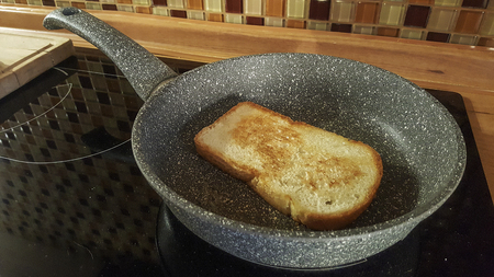 slice of bread roasted on a pan cooker