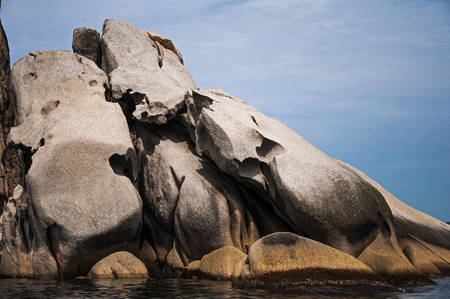color photo of sea stones of strange abstract shapeの写真素材