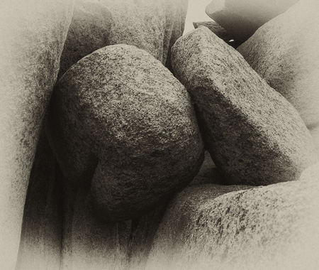 black and white photo of sea stones round and triangularの写真素材