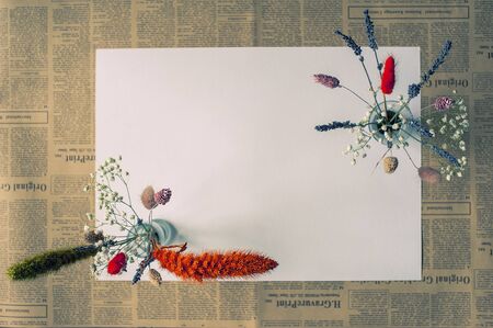 art photo of dried flowers bouquets with lavender in blue tones on a vintage backgroundの写真素材