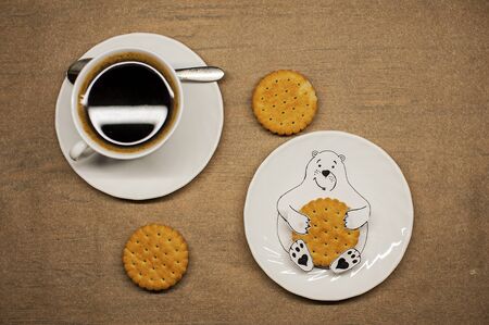 photo of a drawn bear with cookies in its paws and a cup of coffee good morning