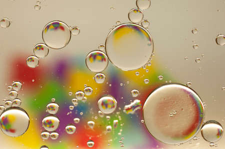 multi-colored drops of oil close-up on a colored background for the backgroundの写真素材