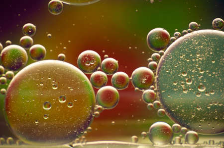 multi-colored drops of oil close-up on a colored background for the backgroundの写真素材