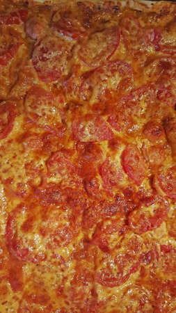 photo of finished homemade pizza close-up for the backgroundの写真素材