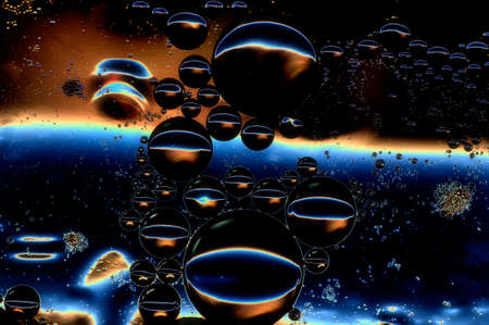 photo blurred abstract background of oil bubbles in low key multicoloredの写真素材