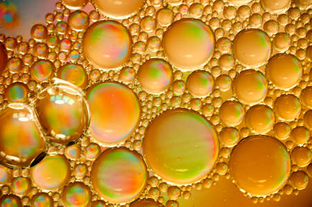 art orange photo of oil drops close up in orange tones for backgroundの写真素材