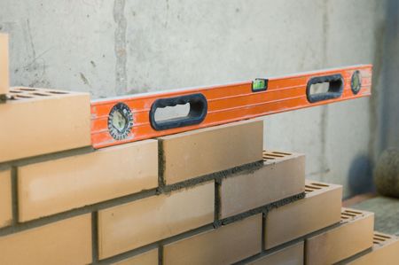 Measurement of level of a brick wall of a building