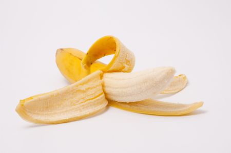 Ripe tasty banana on a light backgroundの写真素材