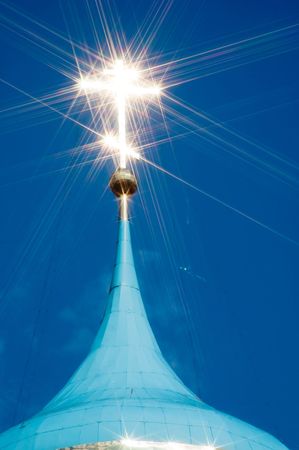 Gold cross on a dome of orthodox church