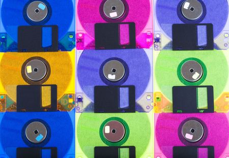 Background consisting of several diskettes of different colorの写真素材