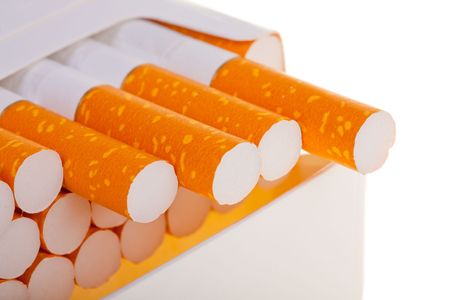 A packet of cigarettes in close-up on a white backgroundの写真素材