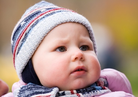 little girl in pink overalls learns to walkの写真素材