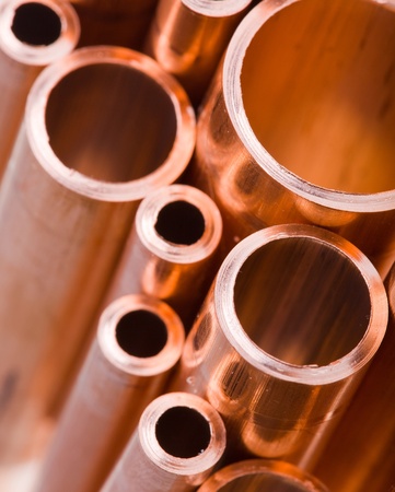 Set of copper pipes of different diameter lying in one heap Set of copper pipes of different diameter lying in one heap