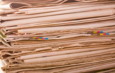 Set of old newspapers combined by a pileの写真素材