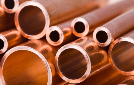 Set of copper pipes of different diameter lying in one heap Set of copper pipes of different diameter lying in one heap