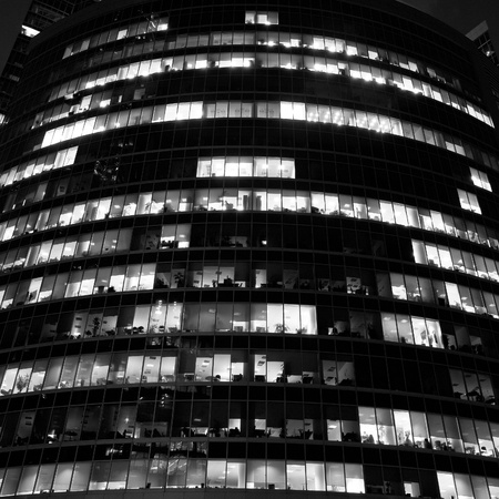 modern office building at night, skyscraper in moscow, foreshortening from belowの写真素材