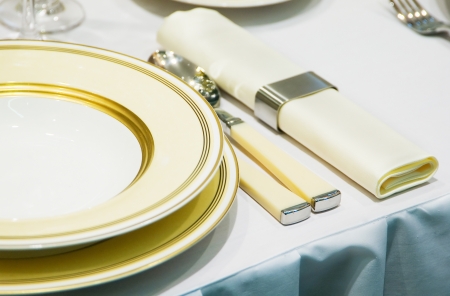 Cutlery on the table near the dish in a restaurantの写真素材
