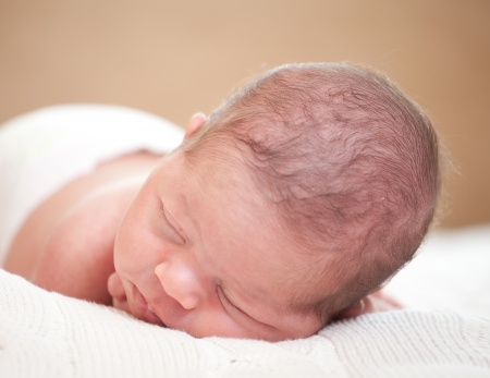 sleeping  newborn baby (at the age of 14 days)の写真素材