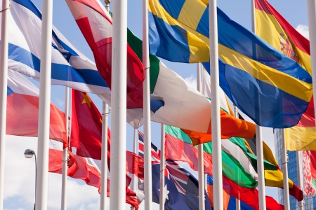 Flags of the world happily blowing in the wind の写真素材