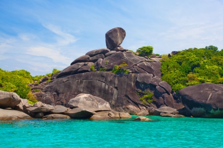 Picturesque bay tropical island surrounded by cliffs and jungleの写真素材