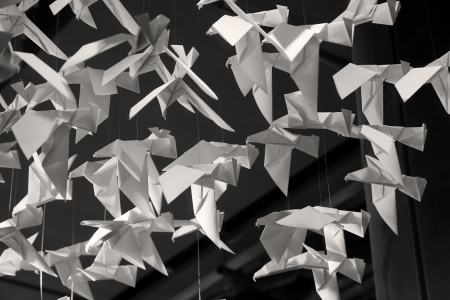 Origamis. Traditional Japanese art of folding from paper of figures of animals and birdsの写真素材